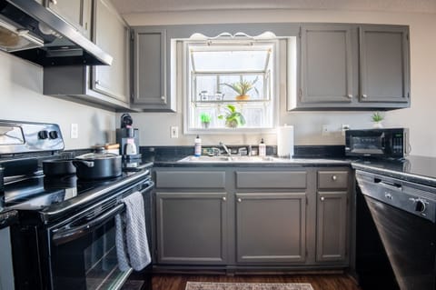 Unit F has a bright kitchen with warm accents to ensure your time there is as relaxing as possible. The kitchen is also completely stocked with anything you might need to whip up your favorite dish!
