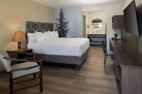 Relax in a bright bedroom with modern furnishings and open flow.