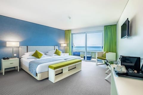 Wake up to ocean views from this bright, serene bedroom.