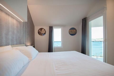 Wake to sweeping sea views right from your bed.