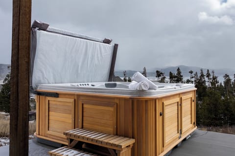 Soak your worries away in this private hot tub, complete with fluffy towels and stunning mountain views for the ultimate relaxation.