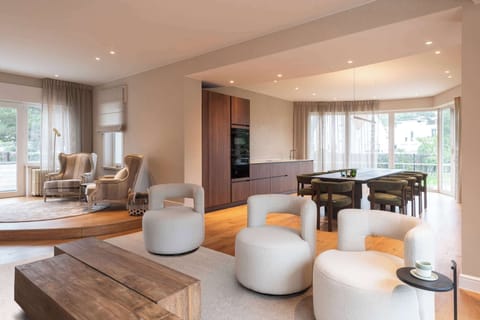 Luxurious open-plan living space with modern kitchen and warm interior design