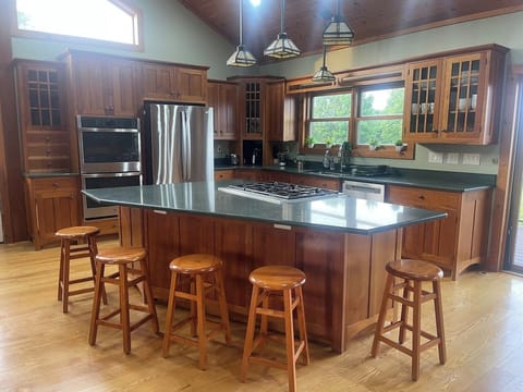 A chef’s dream, this full kitchen makes cooking for your entire crew (or team) a breeze. Located on the main floor next to the living room and directly off the wrap around deck with views of the lake.