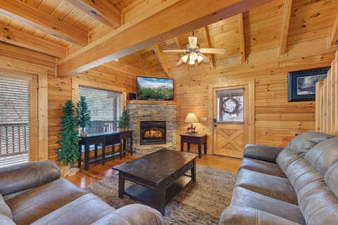 Sink into plush leather seating by your crackling fireplace, where rustic wood beams frame cozy evenings together.