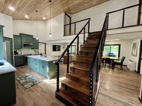 Open concept living space with plenty of room for cooking, socializing, & play