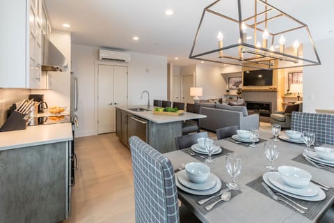Featuring an open-concept layout, the fully equipped kitchen flows seamlessly into the dining area, making it ideal for shared meals and entertaining.