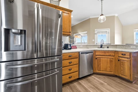 A fully stocked kitchen with appliances is ready for you.