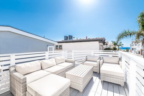 Oceanview deck with generous lounge seating for relaxing under the coastal sun
                