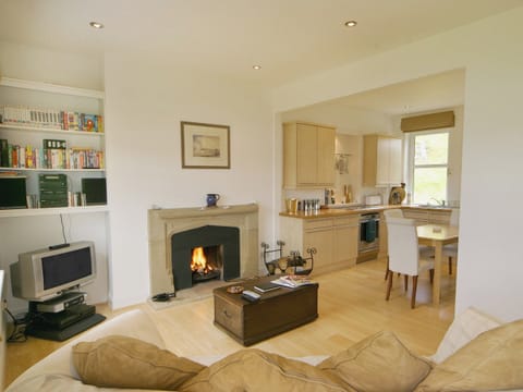 Open plan living space with open fire | Tigh Beg Croft, Lerags, near Oban