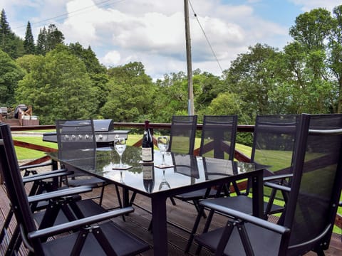 Decked area with garden furniture and gas BBQ | Brandoch Lodge - Kinnaird Estate Cottages, By Dunkeld, Pitlochry