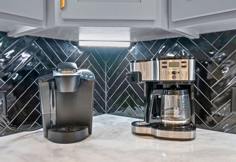 A convenient coffee station and countertop appliances make it easy to start the morning with a fresh cup before heading out for the day.