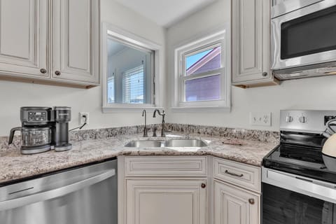 Your fully equipped kitchen features granite countertops, stainless appliances, and everything you need to whip up your favorite meals.