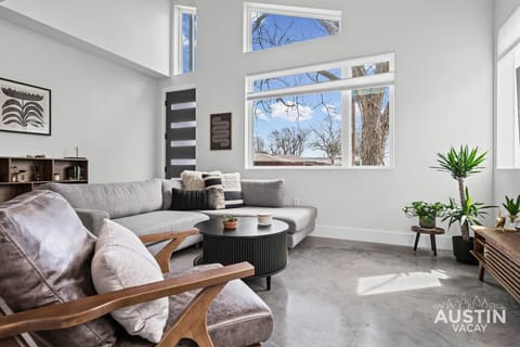 Sunlight, skyline peeks, and a sofa you’ll claim instantly.