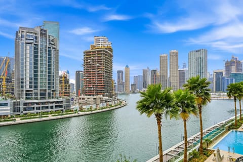 Luxury Waterfront Apartment with Pool & Skyline Views.