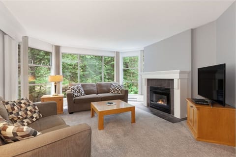 Gather by the glowing fireplace after a day outdoors.