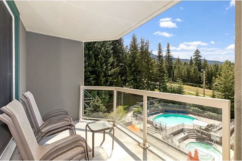 Soak up mountain air from your balcony above the pool.