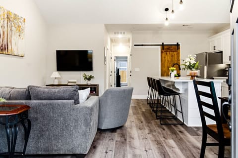 Living Room | Smart TV | Hallway Access & Adjacent Kitchen