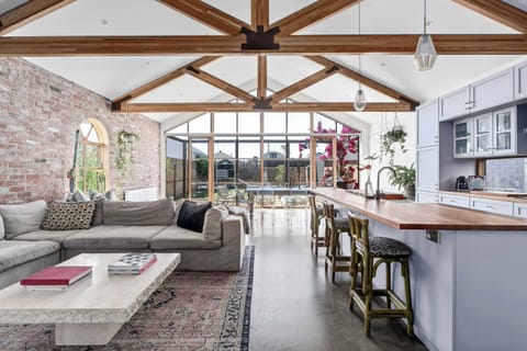 Open plan Kitchen, Living & Dining areas with backyard views