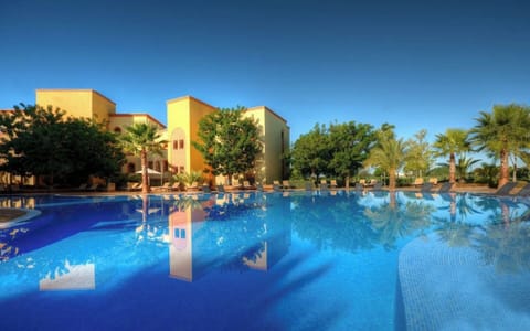 Sip, swim, and savor expansive pool views all afternoon