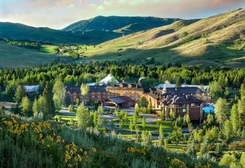 Escape to a mountain resort nestled in golden evening light