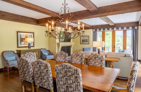 Host celebratory meals at a grand table with cozy living nearby.