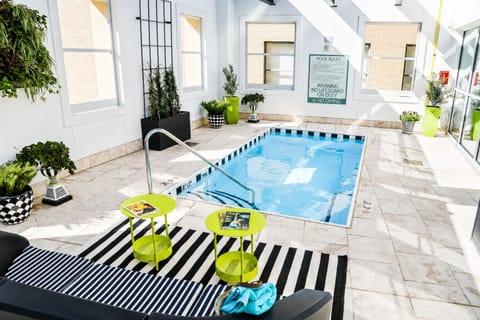 Linger poolside with towels ready for an easy swim break.