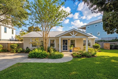 Charming single-story home with covered porch, mature landscaping, and peaceful residential neighborhood setting.