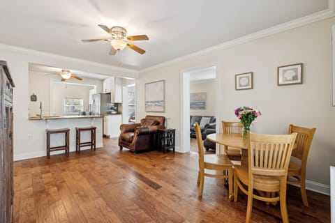 Gather around your dining table while the open kitchen design keeps you connected to family conversations.