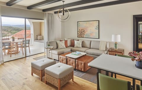 Sip wine by the balcony doors with sweeping countryside scenery.