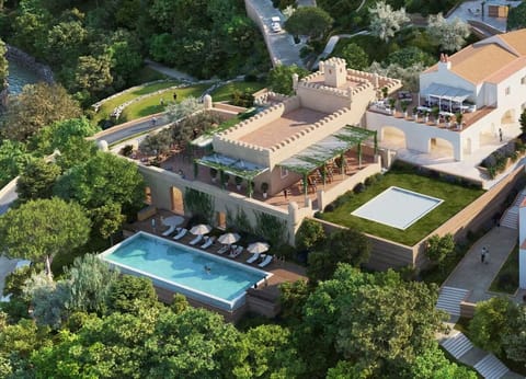 Dive into a tranquil pool surrounded by lush, private greenery.