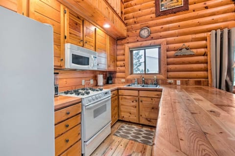 Kitchen | Natural Wood Cabinetry, Breakfast Bar & Window Sink