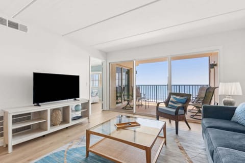 Wide open living room with private oceanfront balcony