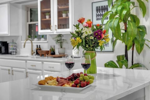 A beautifully styled kitchen scene showcasing the inviting atmosphere of the space.
Wine and charcuterie shown in this photo are for illustrative purposes only and are not included with the reservation.