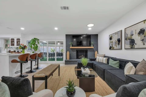 Another angle of the spacious living area showing the open layout that connects the living room, dining area, and kitchen — ideal for groups and families.