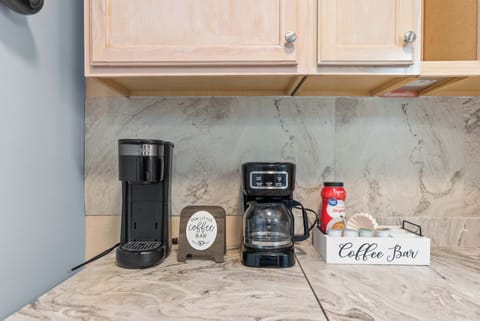 Coffee bar with Keurig, drip coffee maker, and starter supplies