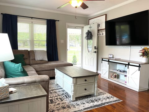 Cozy up on the comfy sleeper sofa for movie night on the smart TV after a long day of adventure. 📺✨