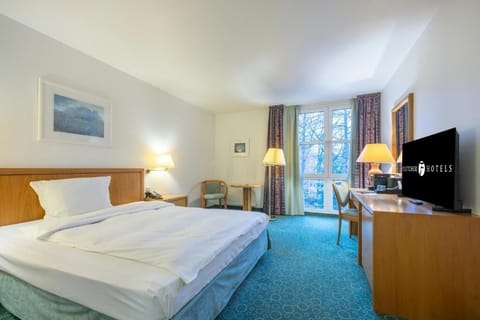 Lounge comfortably in a spacious room with inviting seating.