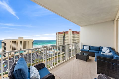 Unwind on your private balcony with plush seating while taking in breathtaking ocean views and coastal skyline.