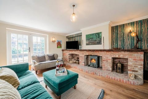 Curl up beside a crackling log burner with a glass of wine on a cosy evening in.