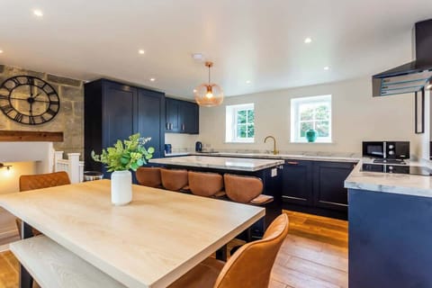 The kitchen dining room is the perfect place to gather the whole group for celebratory drinks and meals. The large dining table will comfortably seat your whole group and the airy space makes the perfect place for chatting while you cook too. 