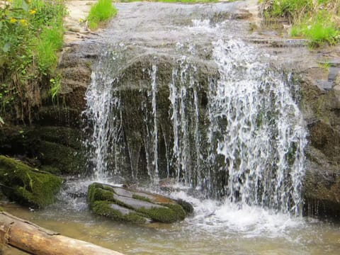 Waterfall right next to house