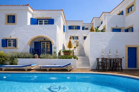 Shared pool courtyard with traditional Cycladic architecture