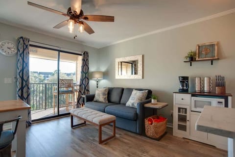 Relax in your cozy living space with coastal touches, complete with balcony views and all the comforts of home.