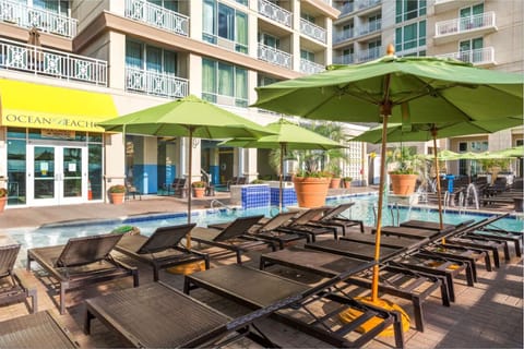 Sip and sunbathe with abundant poolside seating and umbrellas.