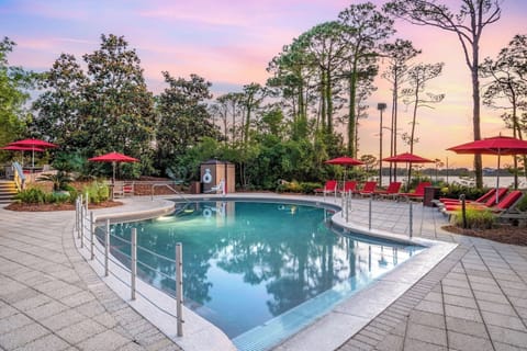 Soak in sunset serenity with spacious poolside loungers.