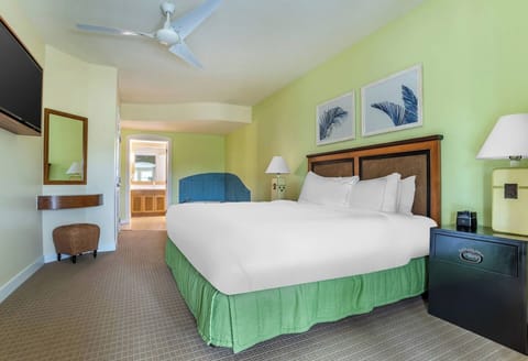 Stretch out in a serene king bed with ceiling fan.