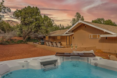 Soak in the hot tub while enjoying stunning sunset views and peaceful desert surroundings.
