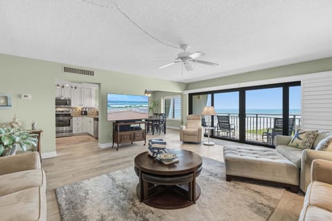 Unwind in this bright oceanfront condo featuring panoramic beach views, an open living area, and private balcony access. Ideal for a relaxing beach stay with coastal comfort, resort amenities, and easy beachfront access.