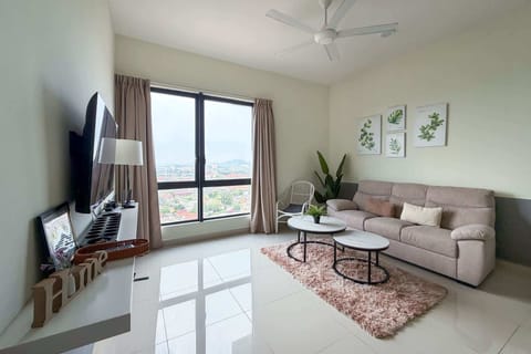 The bright & airy living area with a 3-seater couch.