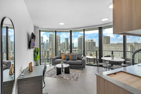 Soak in breathtaking Miami skyline views from this sun-drenched 25th-floor corner retreat! Features a wraparound balcony, sleek kitchen, dedicated workspace, and luxury perks like 24/7 valet. Your perfect downtown oasis awaits!